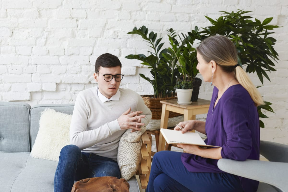 Counselor meeting with patient during addiction treatment session